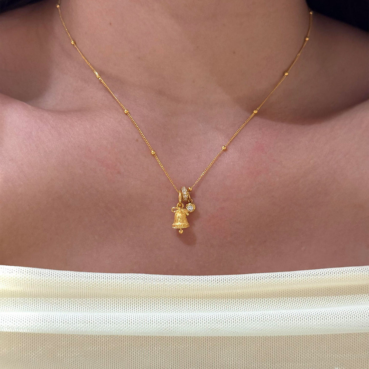 Gold Tone Mini Snowflake Bell Necklace