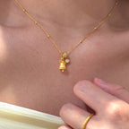 Gold Tone Mini Snowflake Bell Necklace