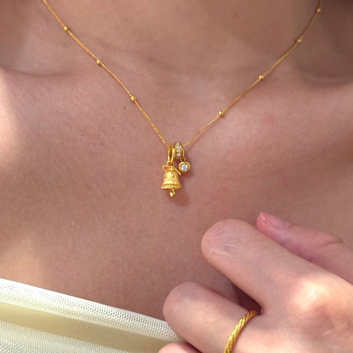 Gold Tone Mini Snowflake Bell Necklace