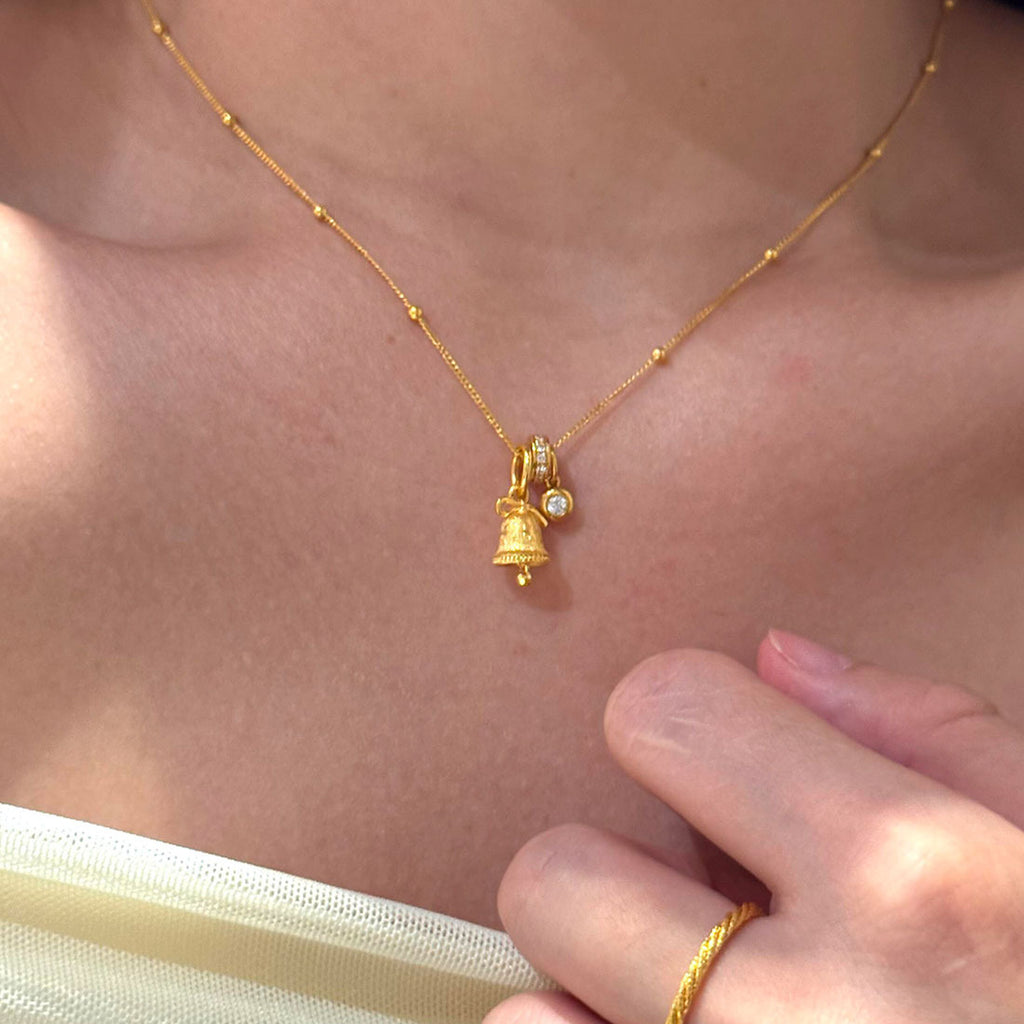 Gold Tone Mini Snowflake Bell Necklace