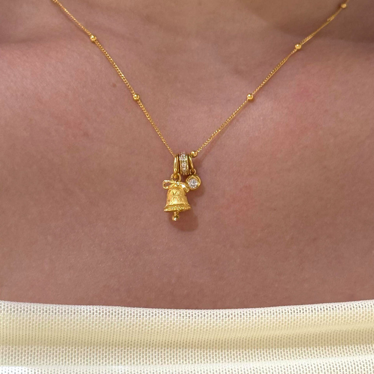 Gold Tone Mini Snowflake Bell Necklace